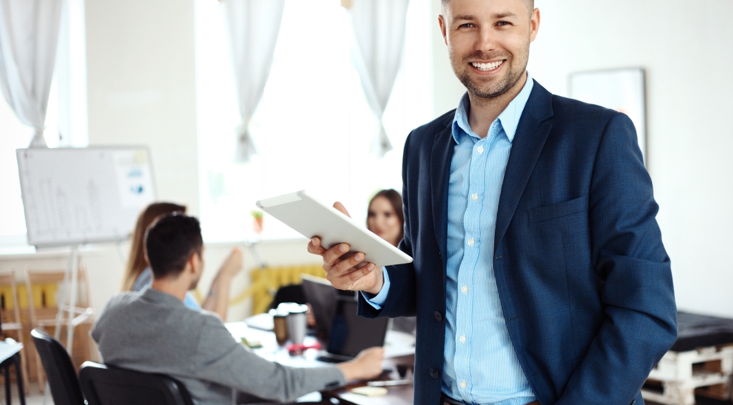 Businessman using his tablet in the office